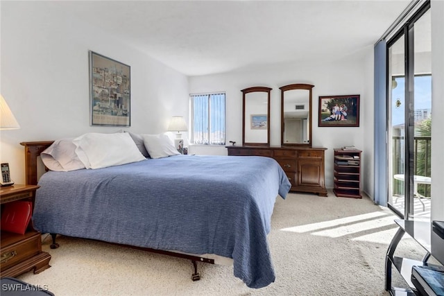 carpeted bedroom featuring a wall of windows and access to outside