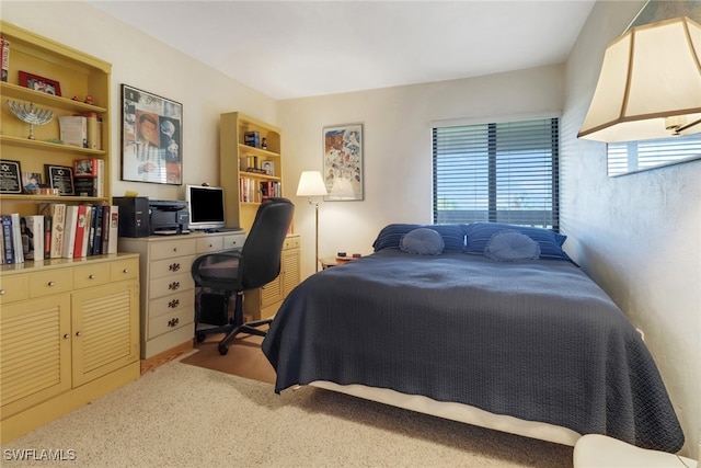 bedroom with light colored carpet