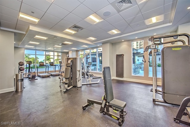 gym with a paneled ceiling