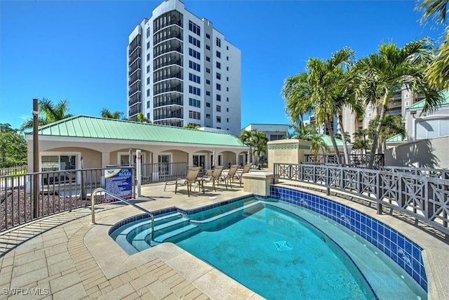 view of swimming pool with a patio