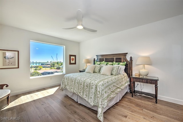 bedroom featuring ceiling fan and light hardwood / wood-style flooring