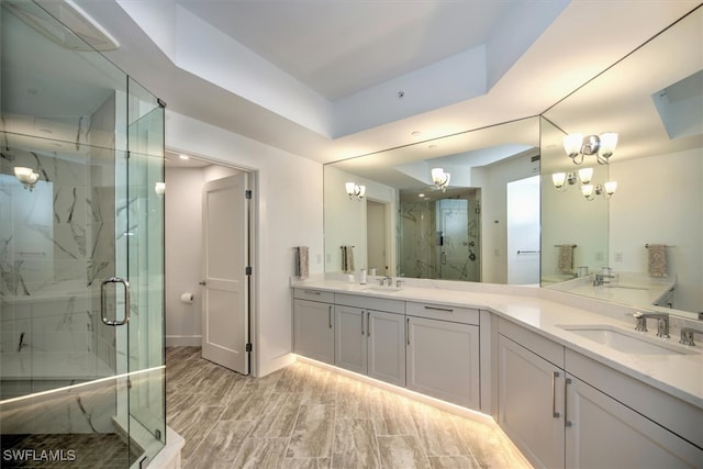 bathroom featuring hardwood / wood-style floors, walk in shower, and vanity