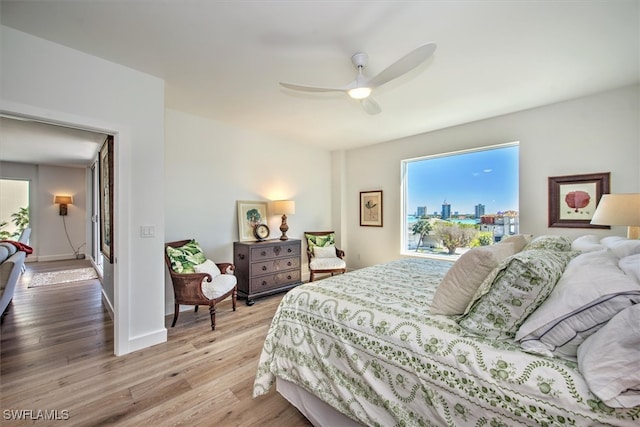 bedroom featuring ceiling fan and light hardwood / wood-style flooring