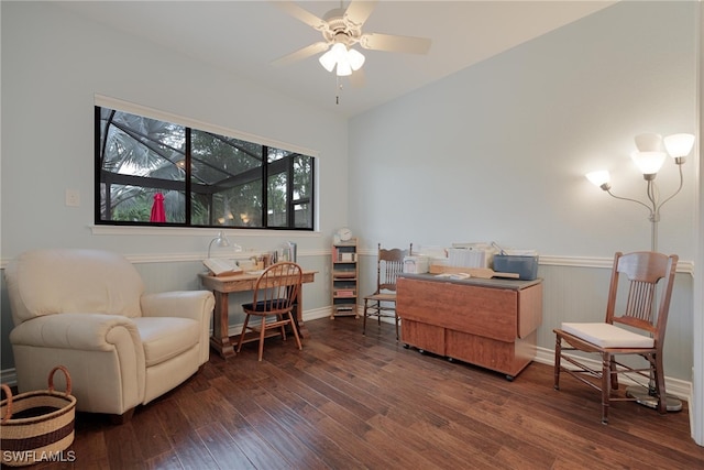 living area featuring dark hardwood / wood-style floors and ceiling fan