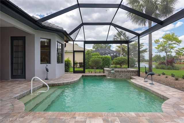 view of swimming pool featuring glass enclosure, an in ground hot tub, and a patio