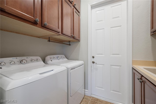 laundry area featuring cabinets and independent washer and dryer