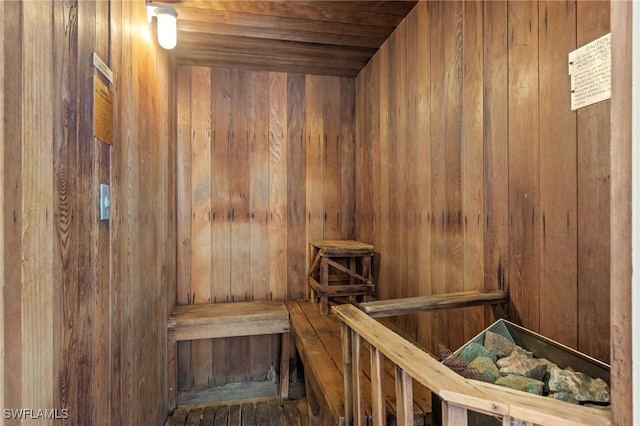 view of sauna / steam room featuring wooden walls and wooden ceiling