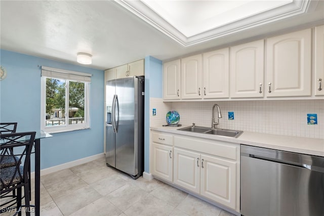 kitchen featuring backsplash, appliances with stainless steel finishes, sink, and light tile patterned floors