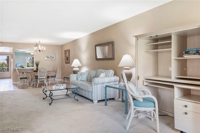 living room featuring light carpet and a chandelier