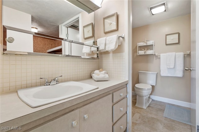 bathroom with visible vents, decorative backsplash, toilet, tile patterned flooring, and vanity