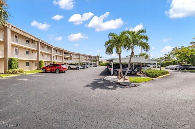 view of partially covered parking lot