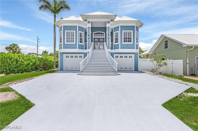 view of front facade with covered porch and a garage