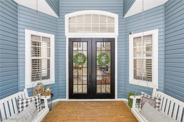 view of exterior entry featuring french doors