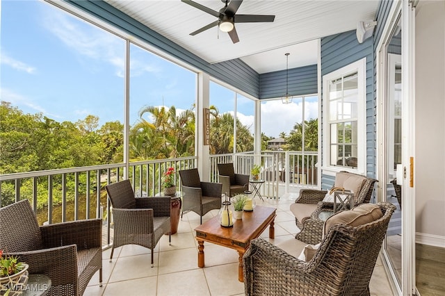 sunroom with ceiling fan and a wealth of natural light