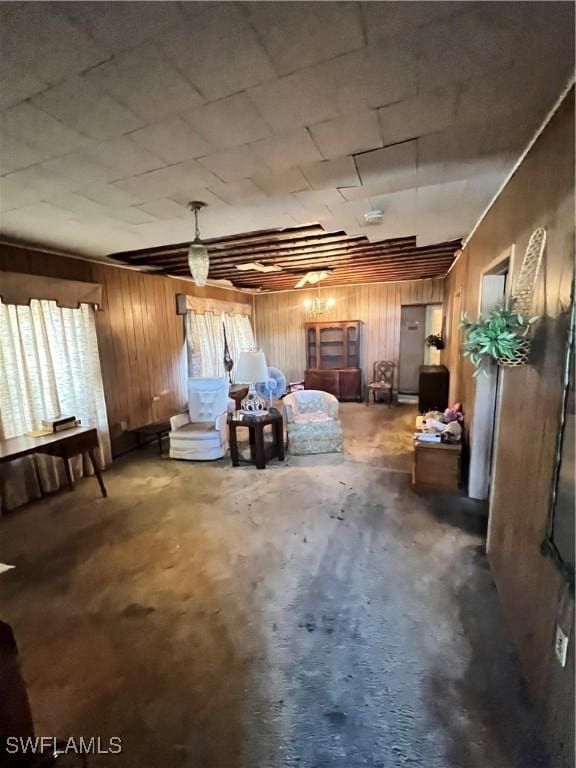 basement featuring wooden walls