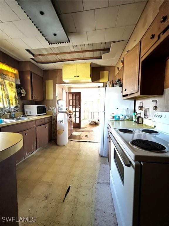 kitchen with sink and white appliances