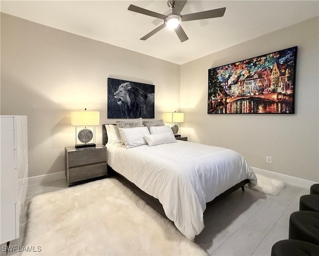 bedroom featuring light colored carpet and ceiling fan