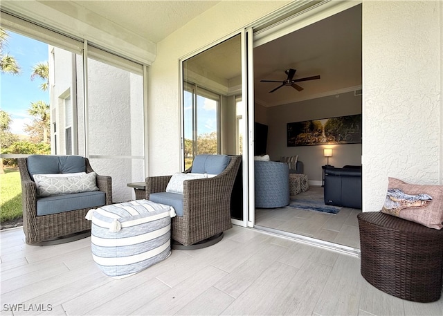 view of patio featuring ceiling fan