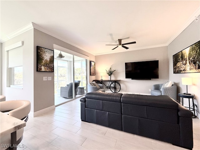 living room with ceiling fan and ornamental molding