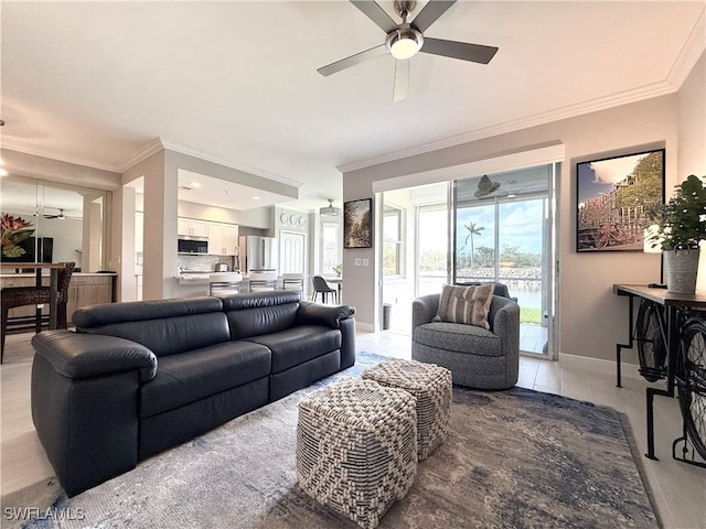 tiled living room featuring ceiling fan and crown molding