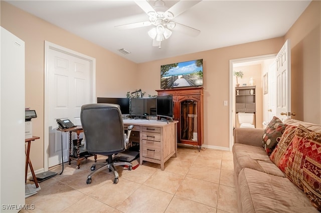 tiled office featuring ceiling fan