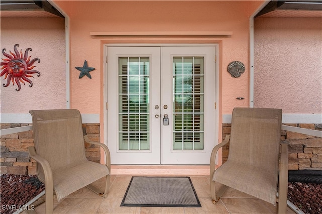 property entrance featuring french doors