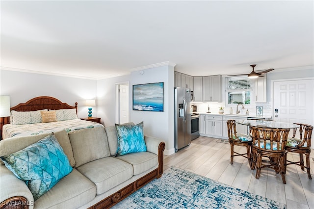 bedroom with stainless steel fridge with ice dispenser, ceiling fan, light hardwood / wood-style floors, and ornamental molding