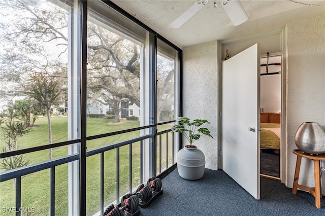 sunroom / solarium with ceiling fan