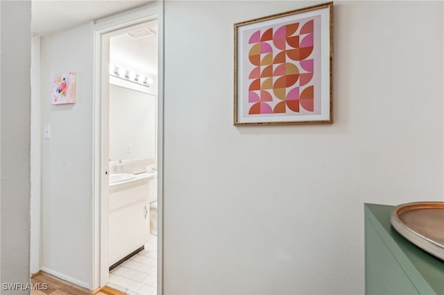 bathroom featuring tile patterned flooring and vanity