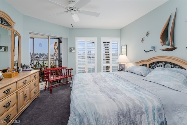 bedroom featuring dark carpet and ceiling fan