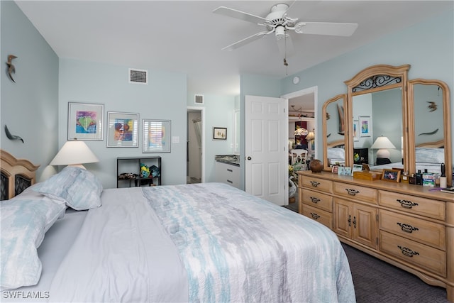 carpeted bedroom with ceiling fan