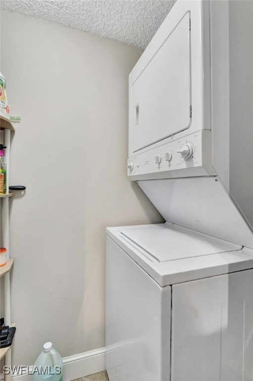 1830 Florida Club Cir Unit 4310, Naples, FL 34112 - laundry area with stacked washer / drying machine and a textured ceiling
