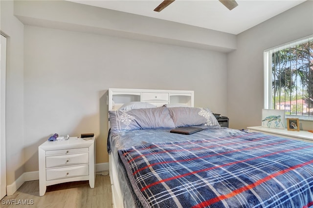 bedroom with ceiling fan and light hardwood / wood-style floors