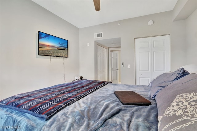 bedroom with ceiling fan and a closet