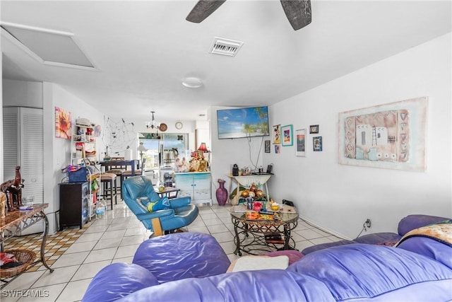 living room with ceiling fan and light tile patterned floors