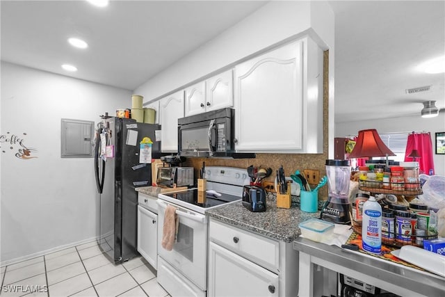 kitchen featuring electric panel, black appliances, white cabinets, dark stone countertops, and light tile patterned flooring