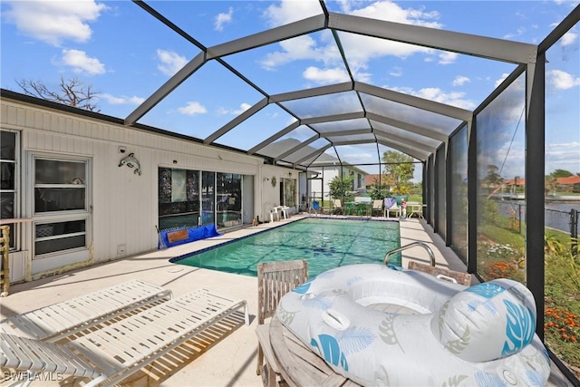 view of pool featuring a lanai and a patio