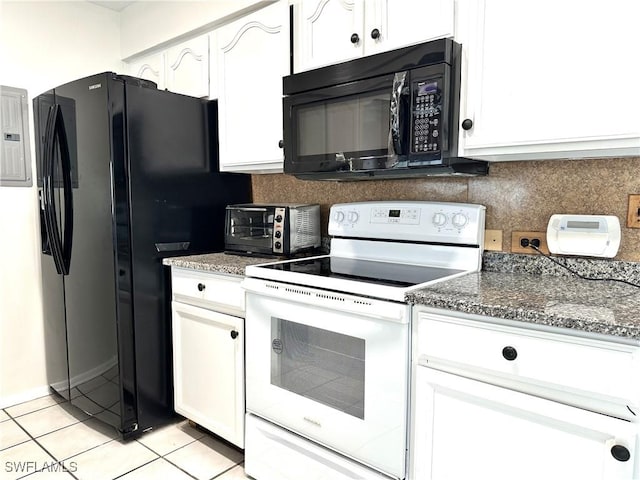 kitchen with dark stone counters, white cabinetry, light tile patterned floors, and black appliances