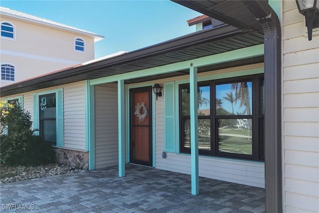 doorway to property with a porch