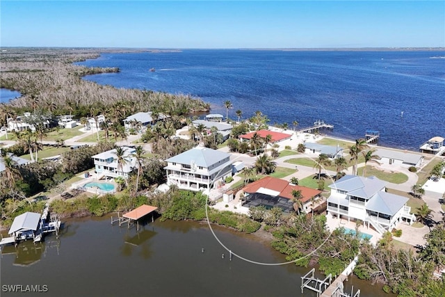 birds eye view of property featuring a water view