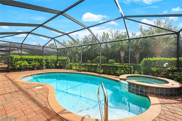 view of pool with a lanai, an in ground hot tub, and a patio