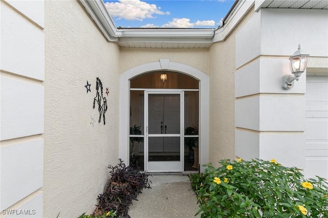 7452 Berkshire Pines Dr, Naples, FL 34104 - doorway to property with stucco siding