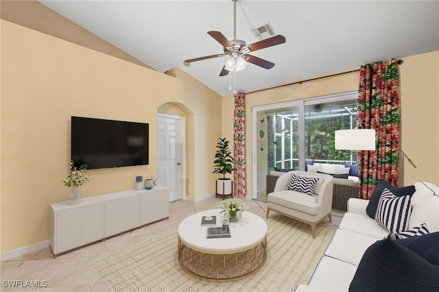 7452 Berkshire Pines Dr, Naples, FL 34104 - living room featuring lofted ceiling, ceiling fan, light tile patterned flooring, and arched walkways