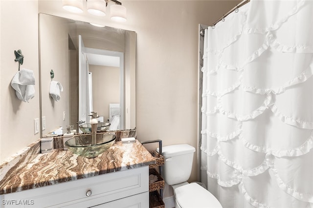 bathroom with vanity and toilet