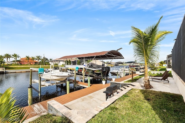 view of dock featuring a water view and a lawn