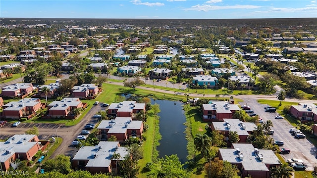 aerial view with a residential view and a water view