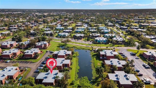 birds eye view of property featuring a water view and a residential view