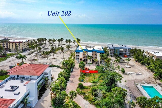 aerial view featuring a water view and a view of the beach