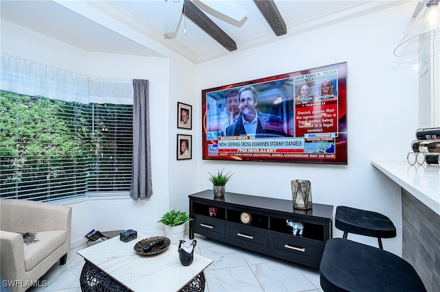 living room featuring beamed ceiling, ceiling fan, and ornamental molding