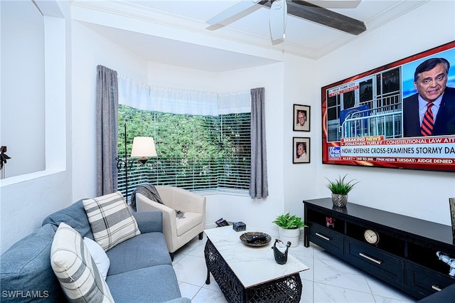 living room with ceiling fan and crown molding